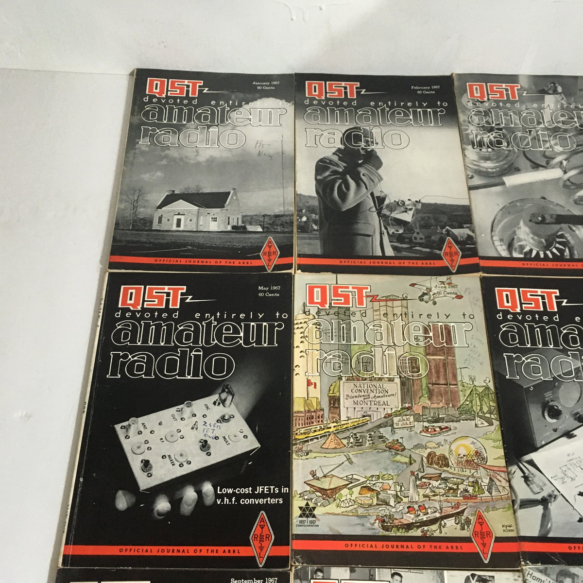 Lot of 12 Complete January to December 1967 QST Amateur Radio magazines featuring multiple issue covers and articles relevant to amateur radio.