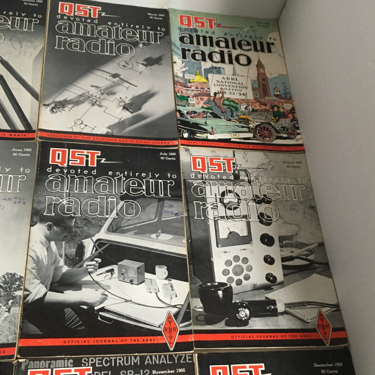 Lot of 12 Complete January to December 1966 QST Amateur Radio Volumes showcasing covers with historical imagery and technical illustrations.