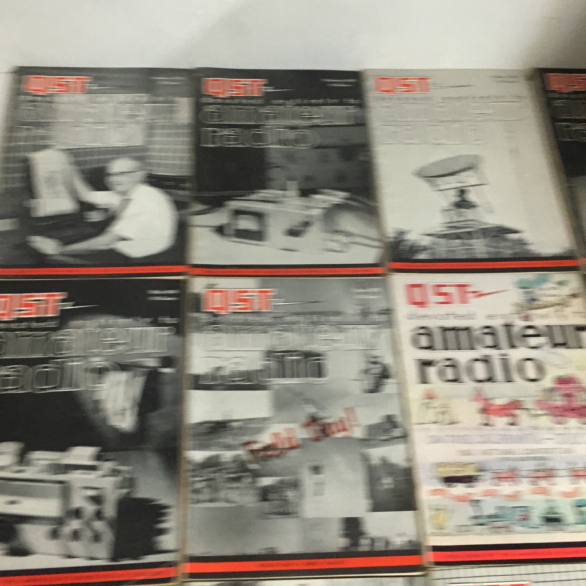 Lot of 12 Complete January to December 1965 QST Amateur Radio magazines with a focus on historical amateur radio themes and photography.