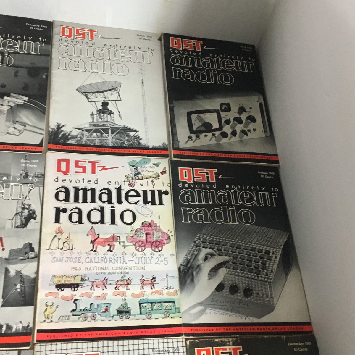 Lot of 12 Complete January to December 1965 QST Amateur Radio magazines displaying the diverse topics and iconic imagery related to amateur radio.