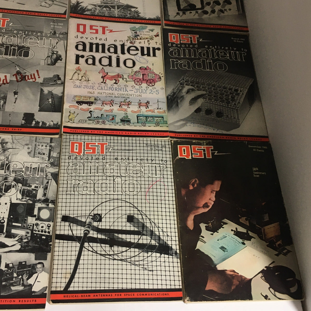 Lot of 12 Complete January to December 1965 QST Amateur Radio magazines depicting significant moments and technical advancements in the amateur radio field.