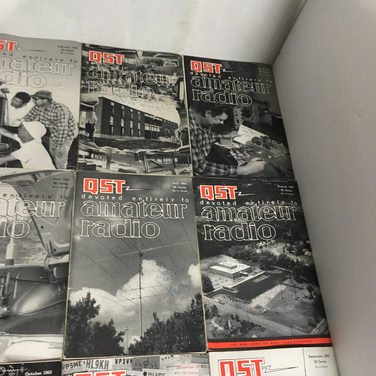 Lot of 12 Complete January to December 1963 QST Amateur Radio Volume 1-12 displaying various issues highlighting amateur radio activities and technology of the 1960s.