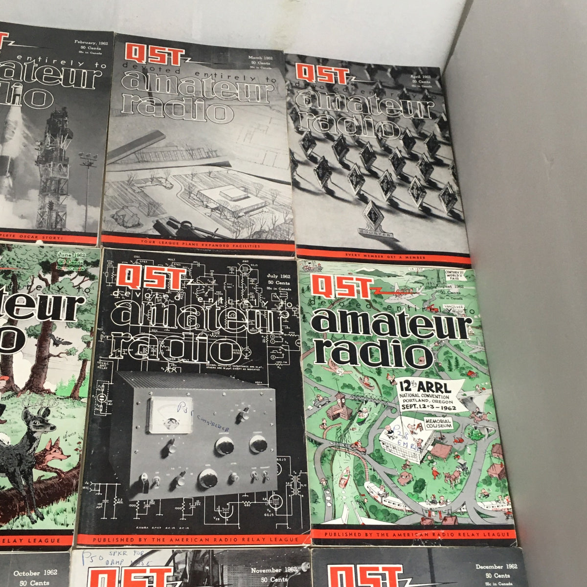 Lot of 12 Complete January to December 1962 QST Amateur Radio showcasing various magazine covers including February, March, July, and December issues.