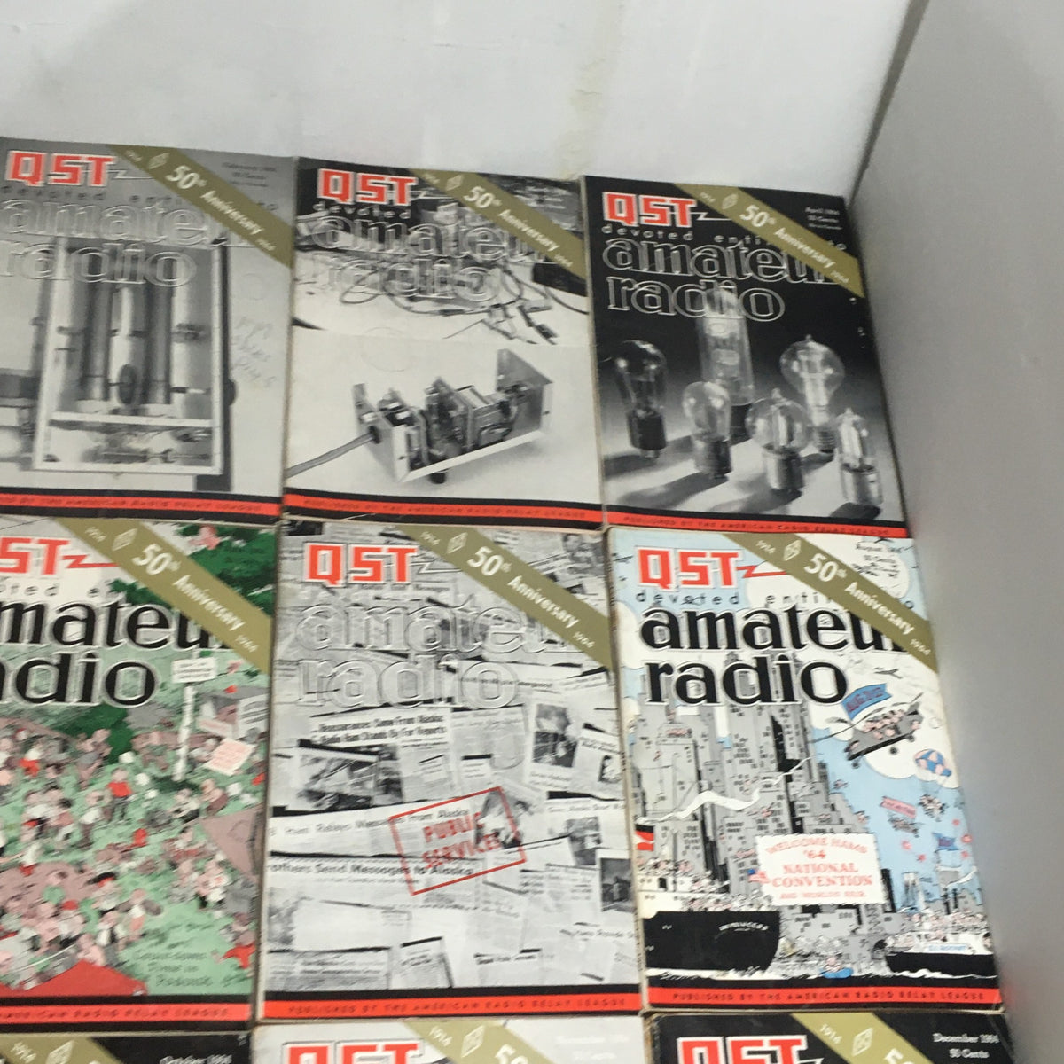 Lot of 12 Complete January to December 1964 QST Amateur Radio magazines, featuring historical articles and illustrations relevant to amateur radio enthusiasts.