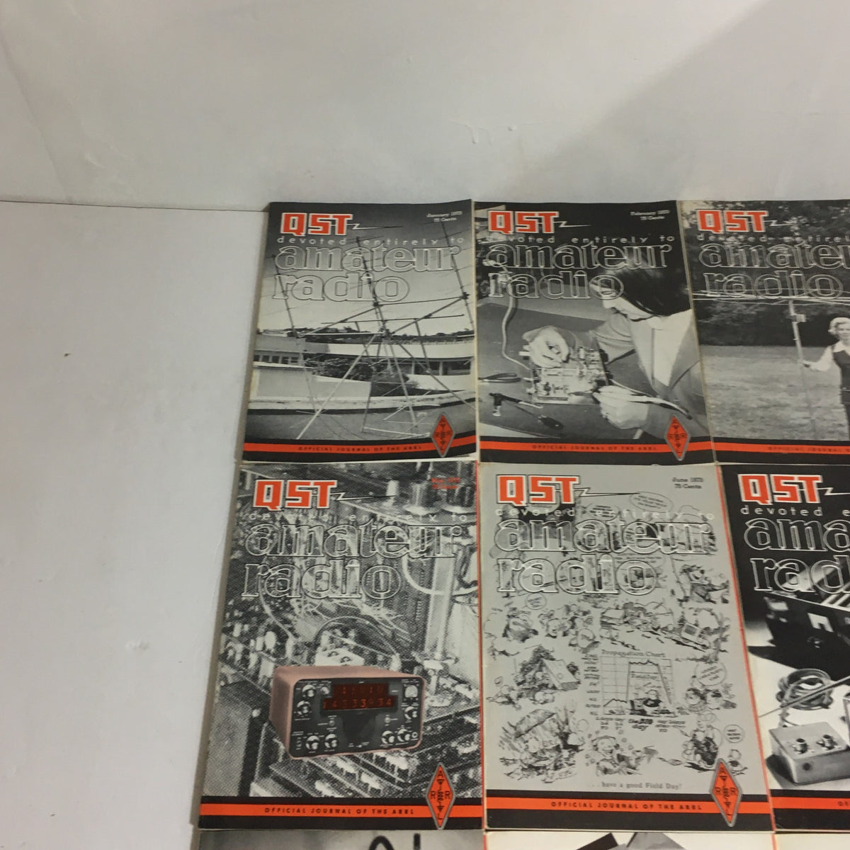Lot of 12 Complete January to December 1973 QST Amateur Radio Volume 1-12 magazine covers showcasing amateur radio equipment and activities.