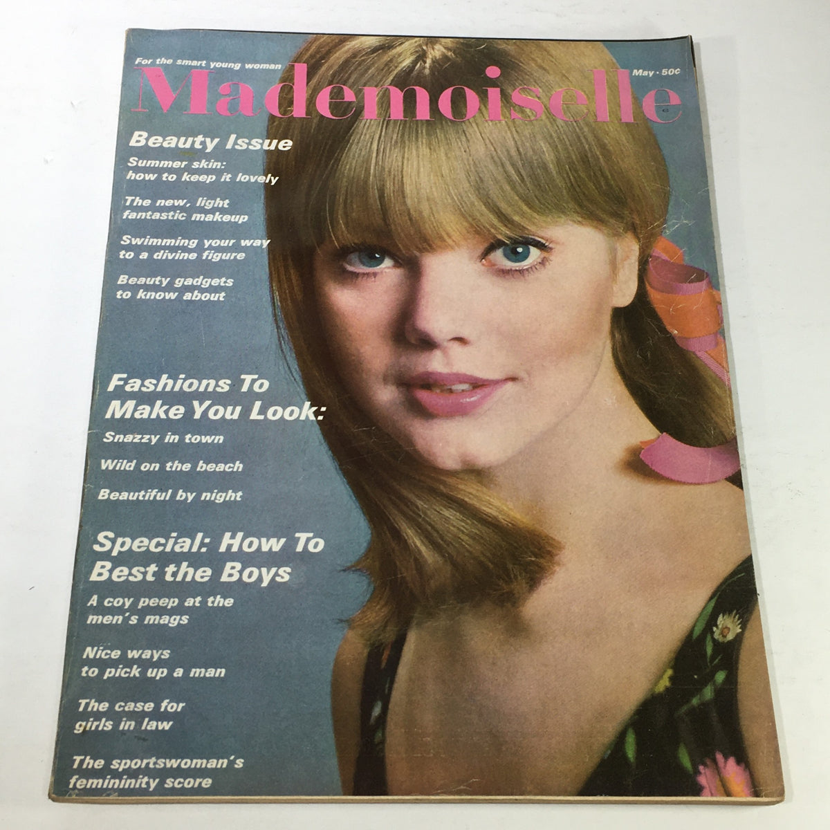VTG Mademoiselle Magazine Cover - May 1965 showcasing a beautiful young woman with long hair and a stylish outfit, featuring articles on beauty, fashion, and social trends of the sixties.