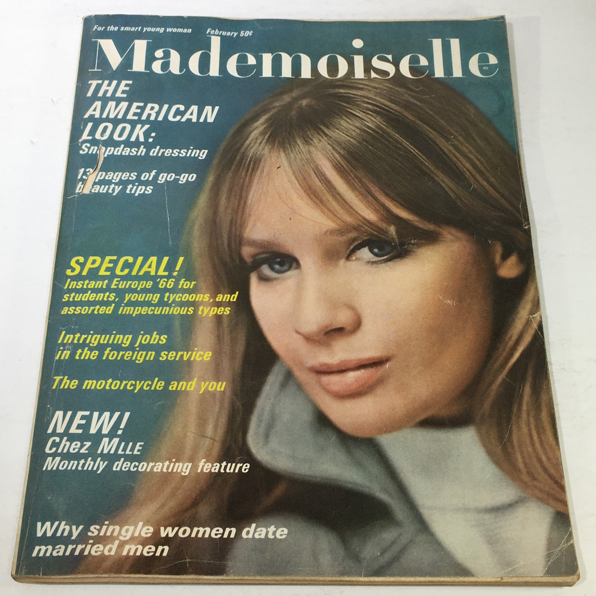 Cover of the VTG Mademoiselle Magazine from February 1966, titled 'The American Snapdash Dressing Issue,' showcasing a young woman with styled hair and makeup, along with text highlighting fashion and beauty tips.