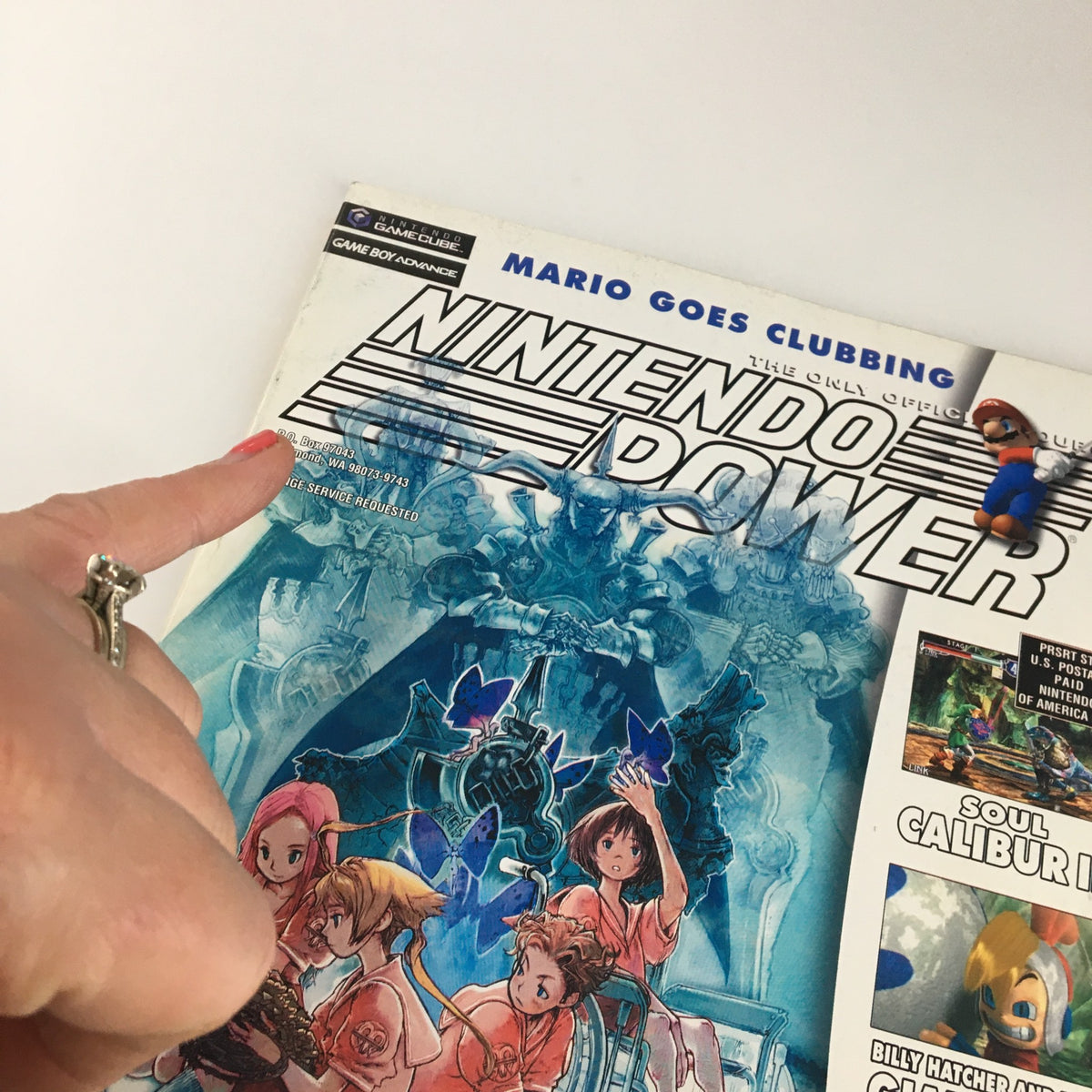 Cover of Nintendo Power Magazine Vol 171 September 2003 featuring art from Final Fantasy Sky Tactic, with a hand pointing towards the title and a Nintendo figurine.