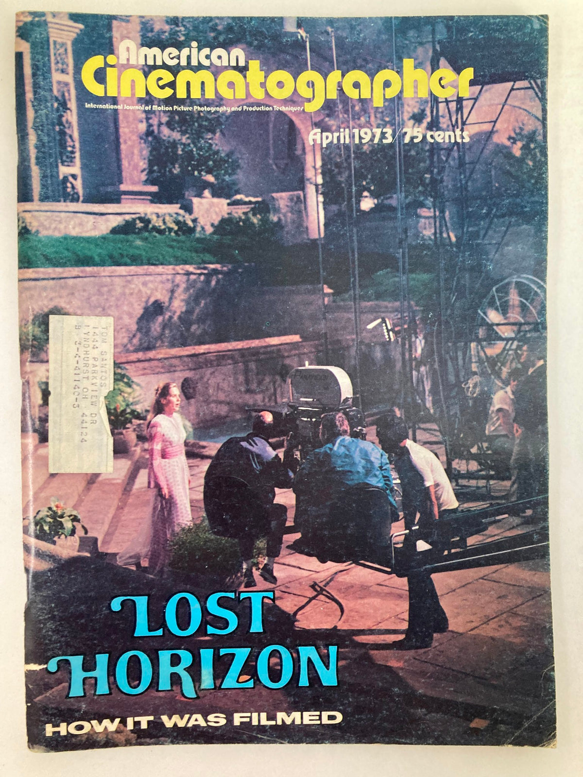 Cover of American Cinematographer Magazine, April 1973 featuring Liv Ullman in 'Lost Horizon,' showcasing a film crew scene behind the camera.