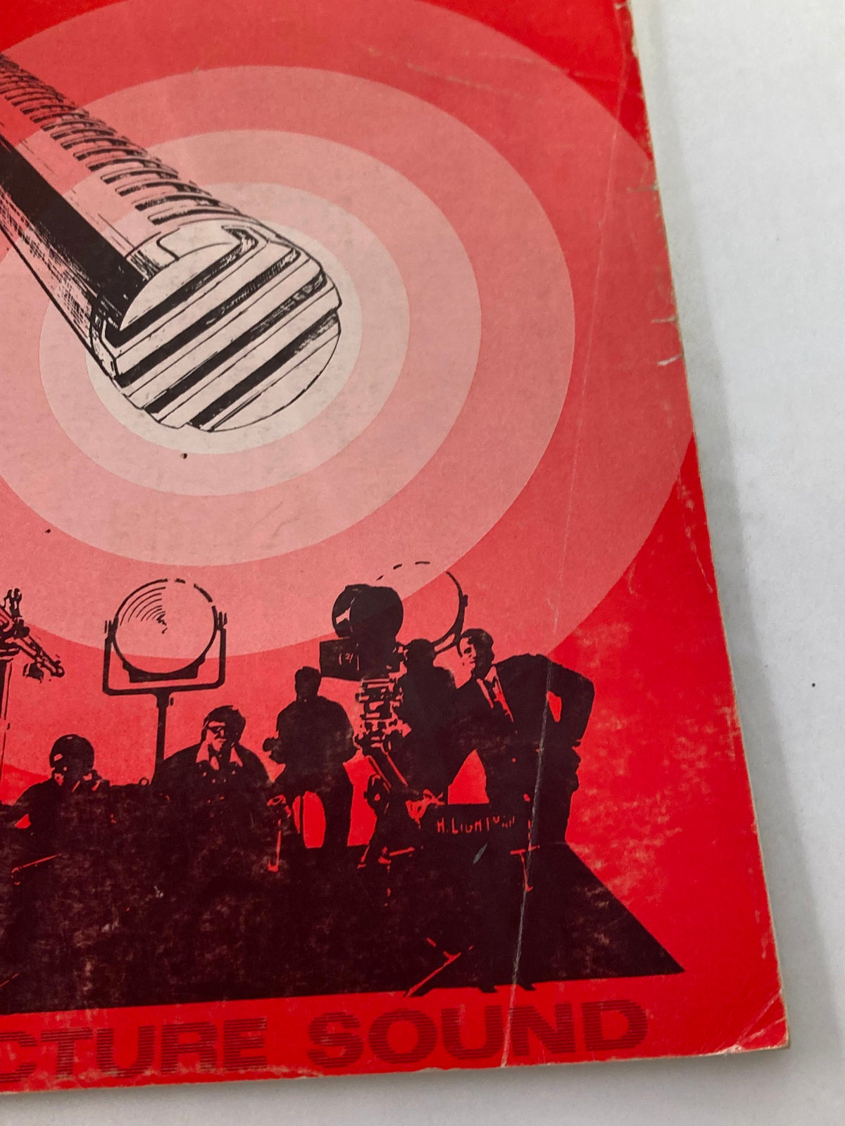 Close-up view of the cover design from American Cinematographer Magazine, April 1971, showcasing a microphone illustration and concentric circles symbolizing sound in film.