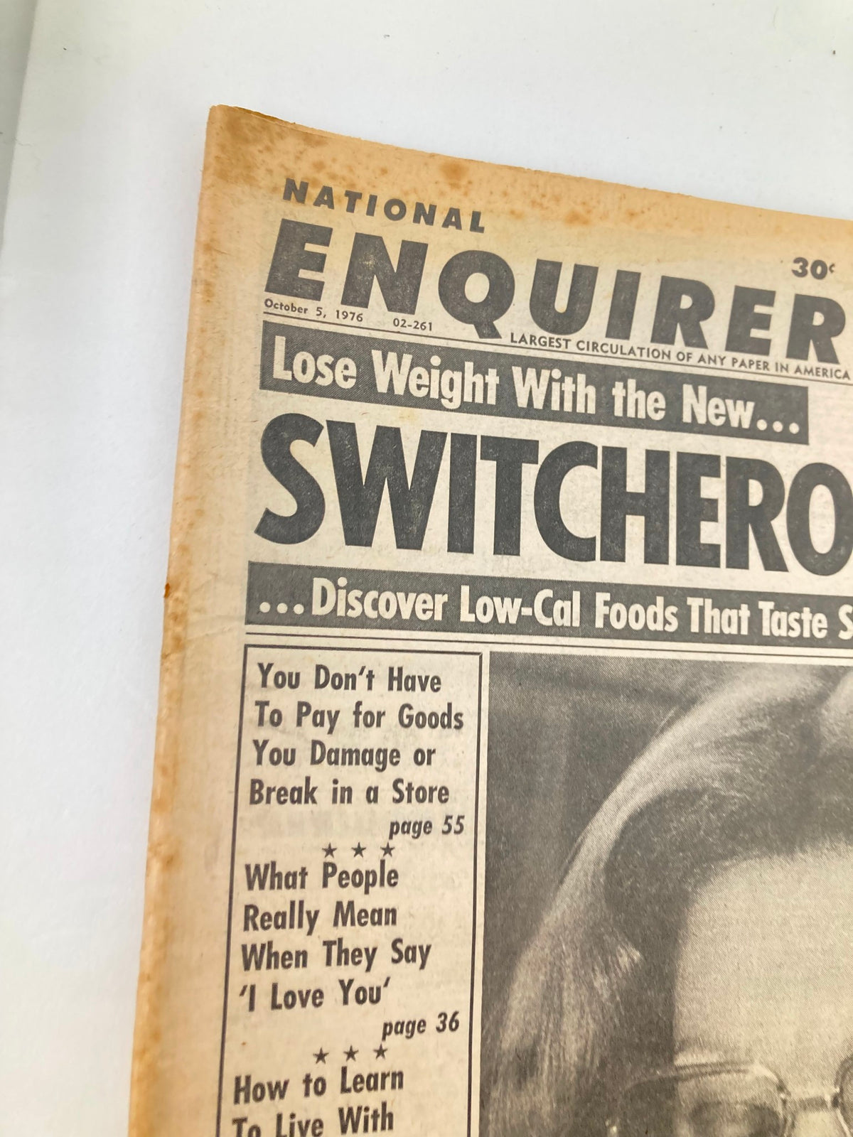 Close-up of the National Enquirer Tabloid from October 5, 1976 emphasizing the headline 'Sophia Loren Forgives Her Father' along with other featured topics from that issue.