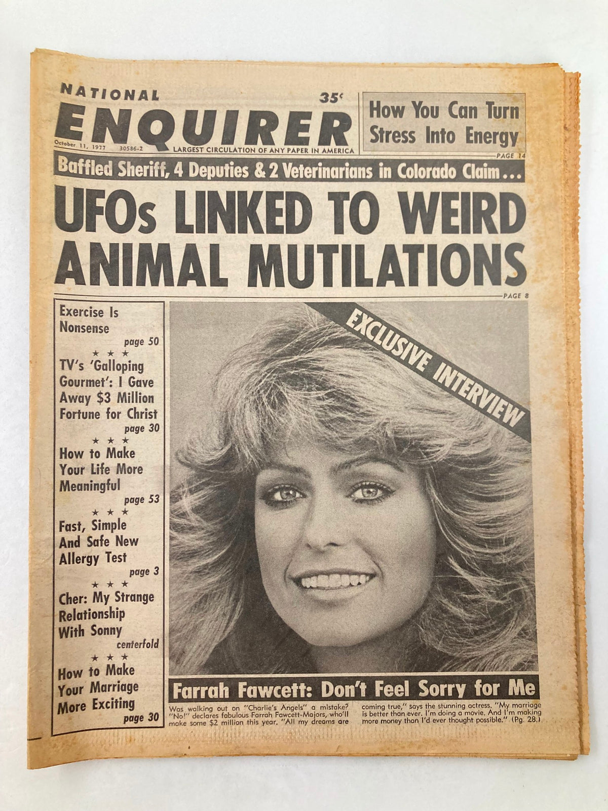 Cover of the National Enquirer tabloid from October 11, 1977, featuring an exclusive interview with Farrah Fawcett titled 'Don't Feel Sorry for Me', and headlines about UFOs and animal mutilations.