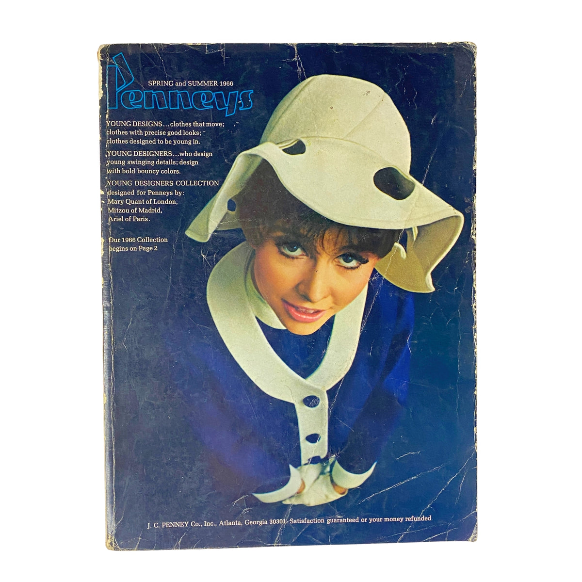 1966 JC Penneys Spring and Summer Store Catalog cover featuring a model wearing a large white hat and a blue outfit, showcasing mid-1960s American fashion trends.