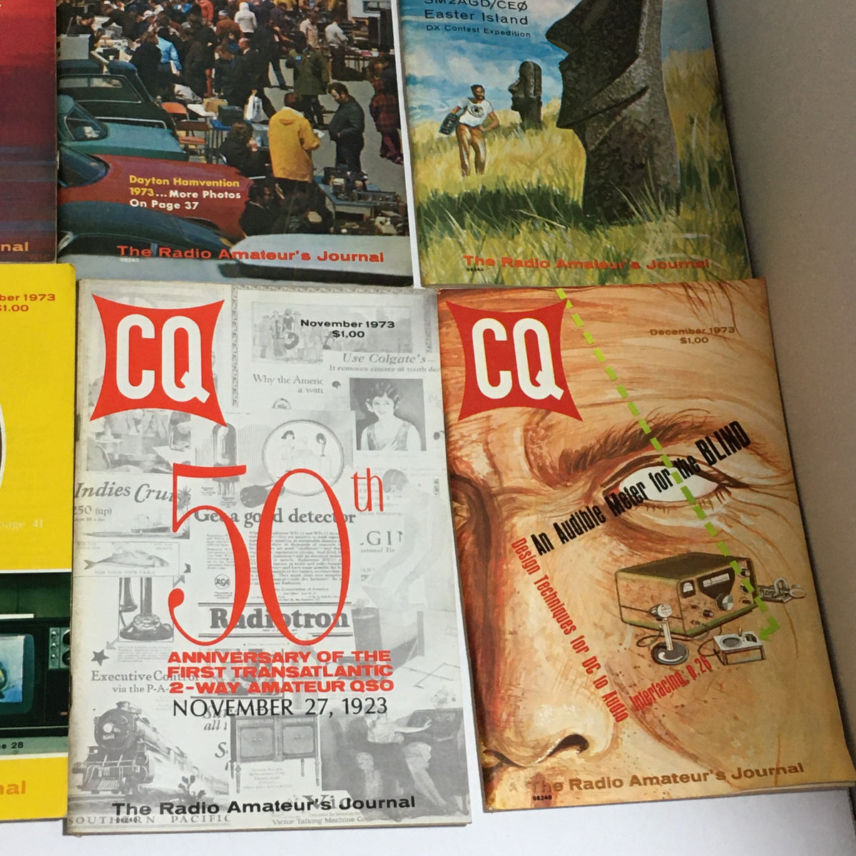 November and December 1973 editions of CQ The Radio Amateur's Journal, highlighting significant anniversaries and features related to amateur radio.