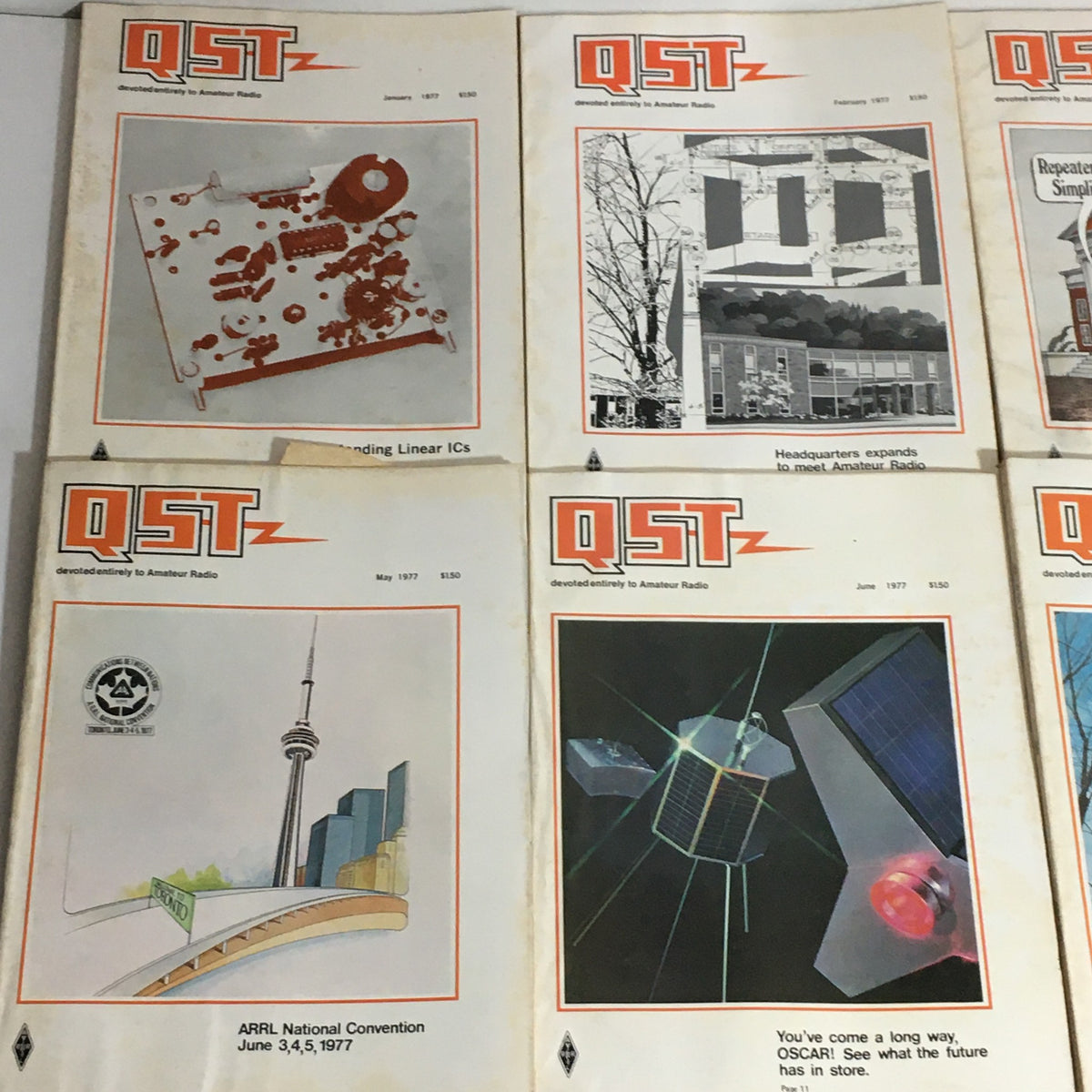 Lot of 12 Complete January to December 1977 QST Amateur Radio magazines, showcasing covers that include topics like linear ICs and ARRL National Convention.
