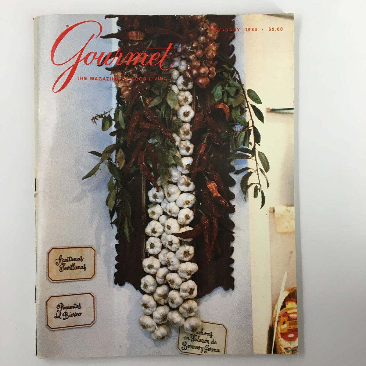 Vintage Gourmet Magazine February 1983 cover featuring decorative garlic and chili peppers, highlighting Sunny Flavors of Spain.