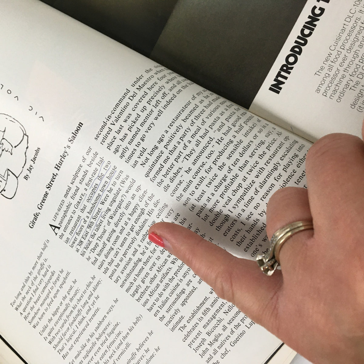 Page from the VTG Gourmet Magazine August 1981 featuring a review or article, with a finger pointing at text, reflecting the sophistication of the 1980s dining scene.