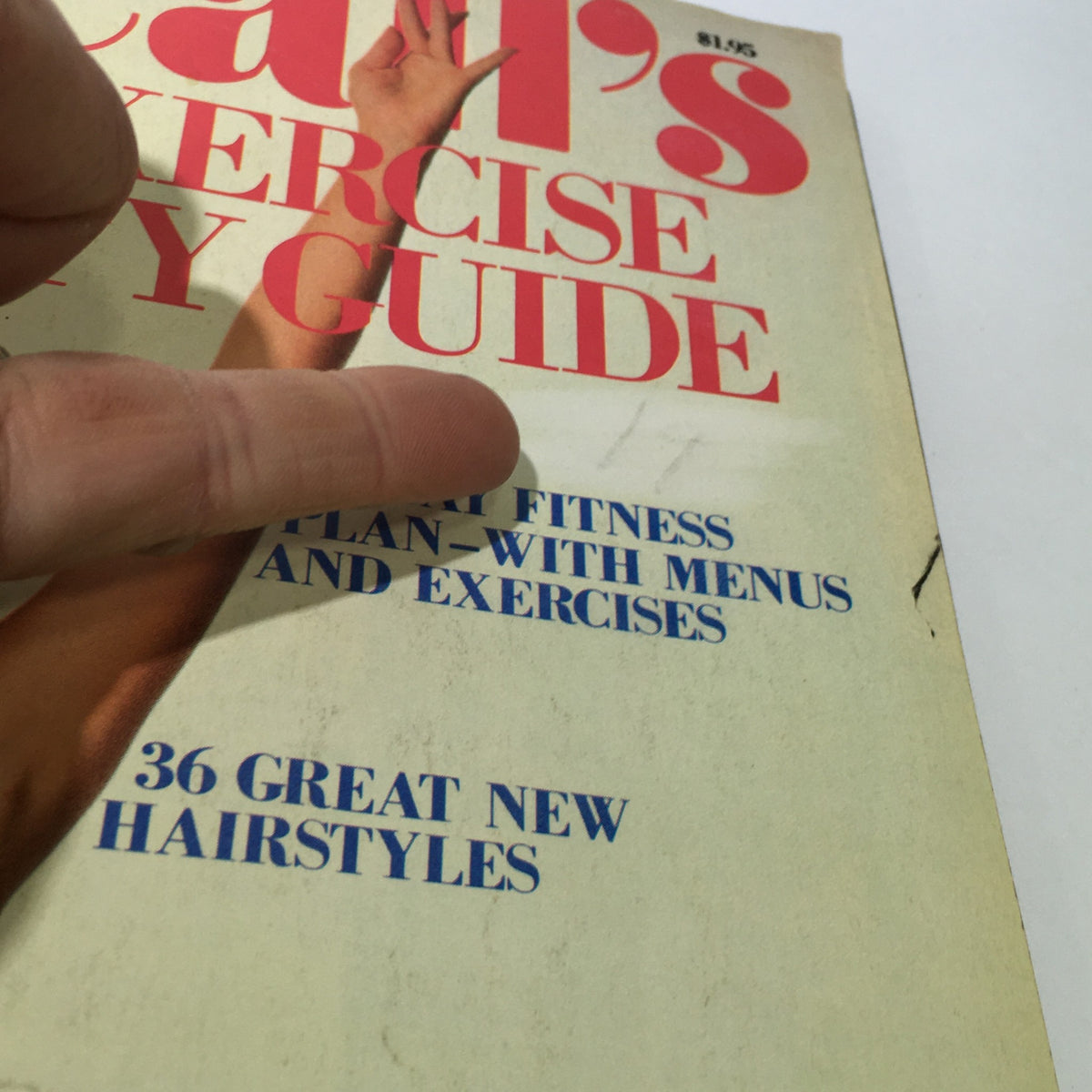 Close-up of the cover of VTG McCall's Magazine: 1982 - Diet, Exercise & Beauty Guide emphasizing key articles about fitness plans and new hairstyles.