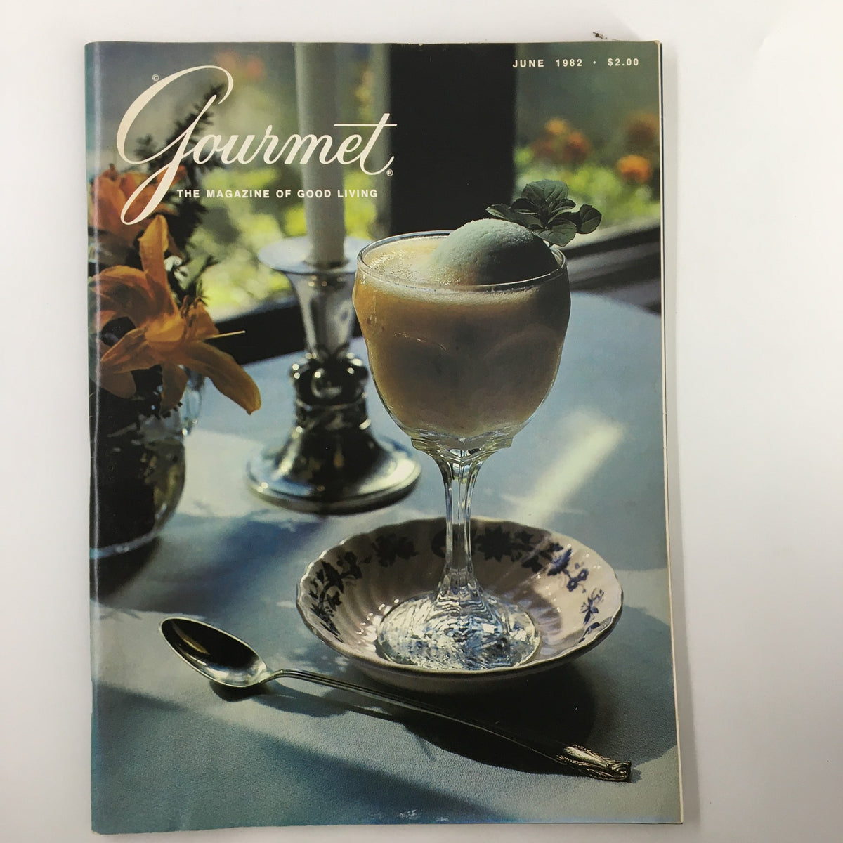 Vintage Gourmet Magazine June 1982 cover featuring foamy fruit drinks known as shrubs. Highlights the culinary trends of the early 1980s with a decorative glass and dining table setting.