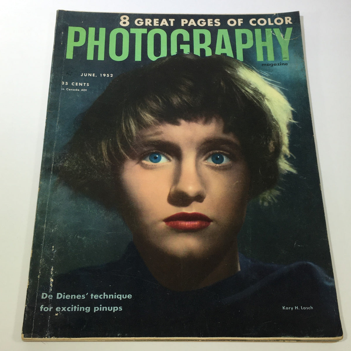 Vintage Photography Magazine Cover from June 1952 featuring notable techniques of Kary H. Lasch De Dienes, showcasing a striking portrait with vibrant blue eyes and bold lipstick, highlighting photography trends of the early 1950s.