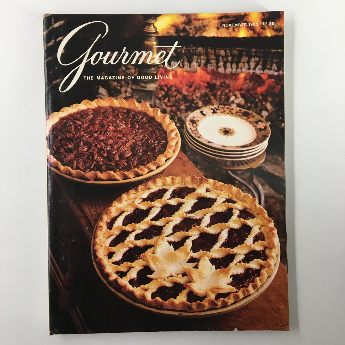 Cover of VTG Gourmet Magazine November 1985 featuring a rustic display of two pies, a pecan pie and a raspberry pie, capturing the essence of fine dining and gourmet recipes from that era.