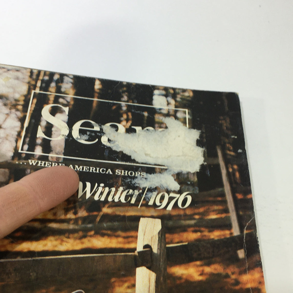 Close-up of the cover of the VTG Sears Catalog: Fall Winter 1976, featuring the title and a vintage design that reflects the era's retail branding.
