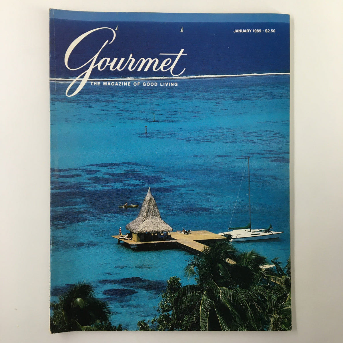 VTG Gourmet Magazine January 1989 The Last Touch Hot Canapes cover showcasing vibrant blue ocean scenery with a thatched hut, emphasizing the theme of good living.