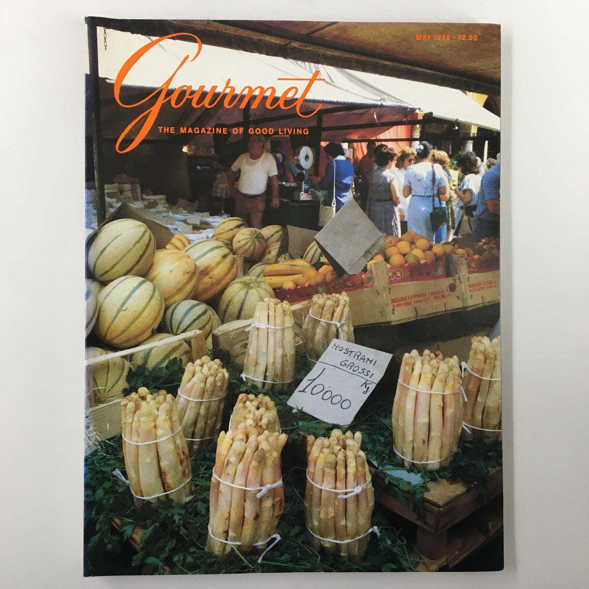 Cover of VTG Gourmet Magazine May 1988 featuring Padua's Piazza delle Erbe, showcasing a vibrant market scene with melons and asparagus, representing culinary culture.