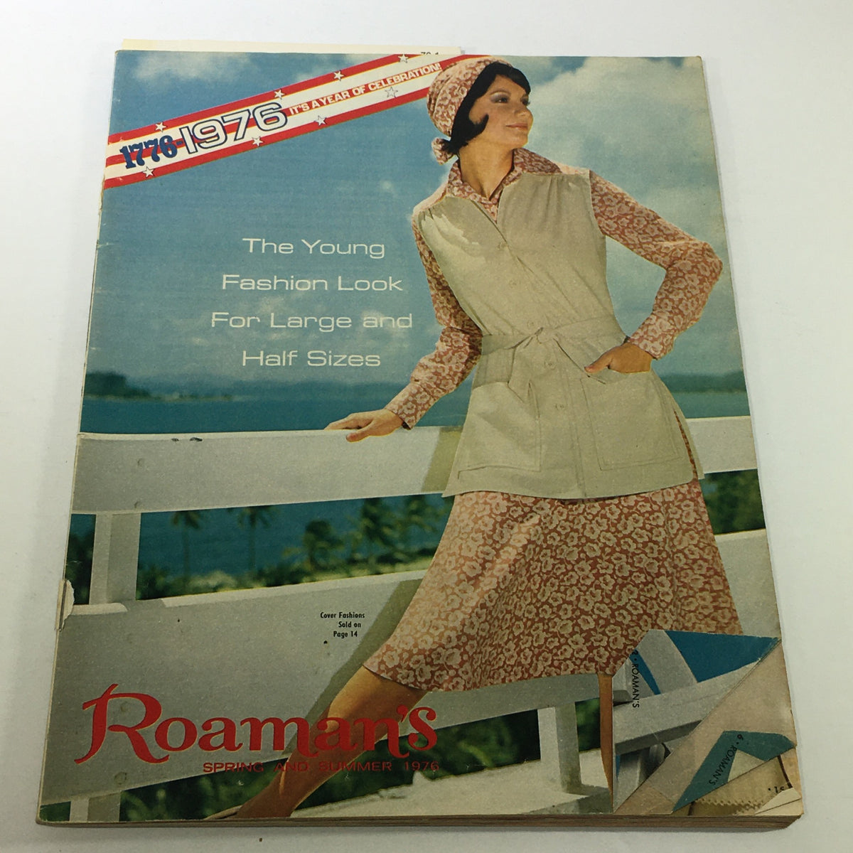 VTG Roaman's Catalog: Spring Summer 1976 cover featuring a model in a floral dress and a light vest, showcasing fashion looks for large and half sizes.