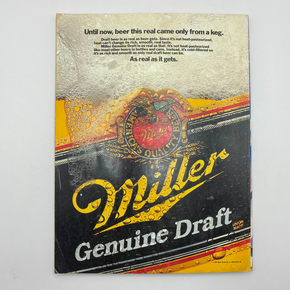 Back cover of Playboy Magazine January 1988 featuring an advertisement for Miller Genuine Draft beer, highlighting its rich taste and quality.