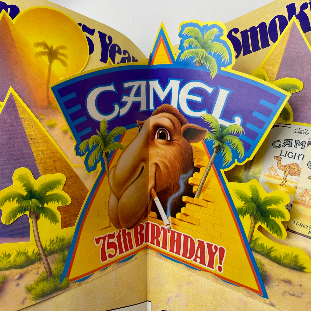 Playboy Magazine March 1988 featuring a Camel branded advertisement celebrating its 75th birthday with vibrant colors and pyramid imagery.