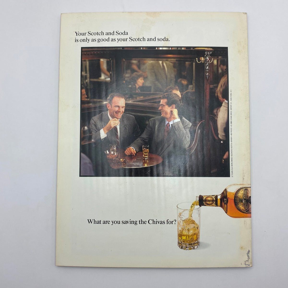 Back cover of Playboy Magazine May 1988 featuring an advertisement for Chivas Regal, depicting two men enjoying Scotch and Soda, and highlighting the social aspect of enjoying quality beverages.