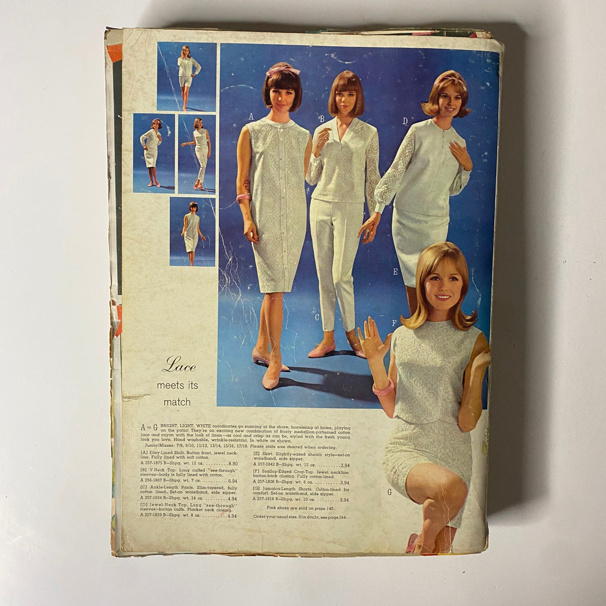 1965 JC Penneys Spring and Summer Store Catalog displaying stylish lace dresses and outfits. The image features models showcasing fashionable clothing items typical of mid-1960s American style.