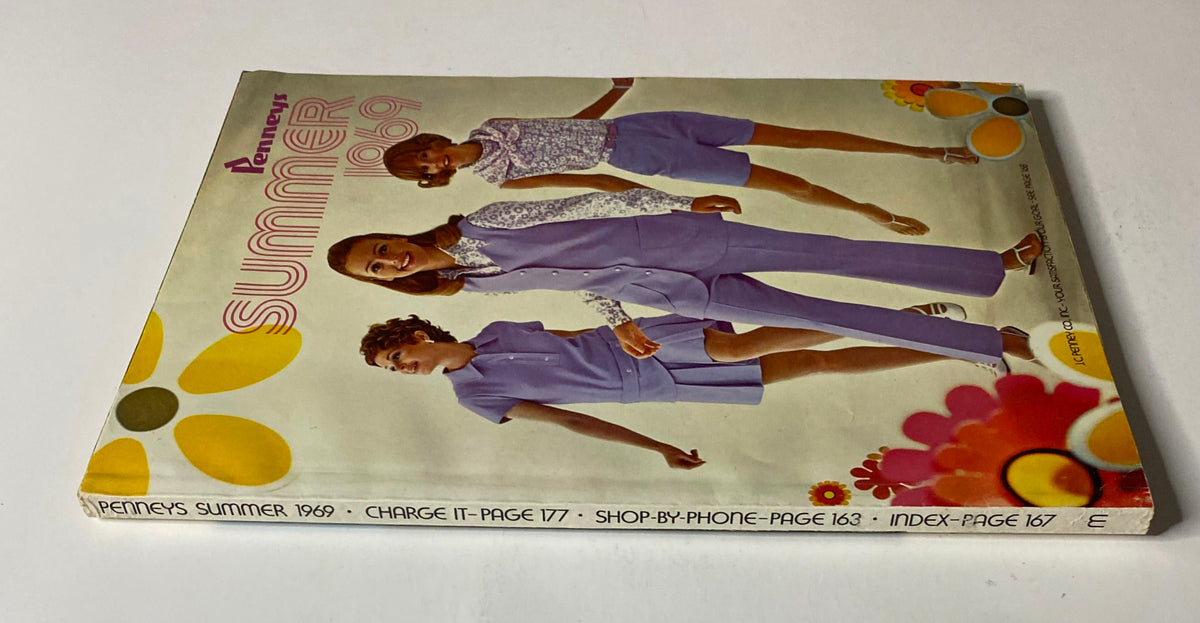 Side view of the 1969 JC Penneys Summer Store Catalog, highlighting the colorful cover with models in matching purple outfits and flowers, representing vintage summer styles.