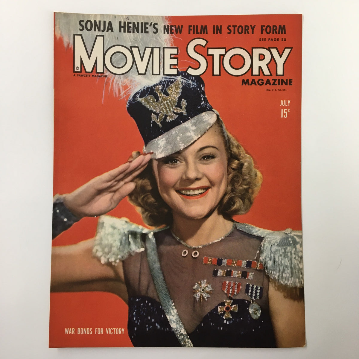 COVER ONLY Movie Story Magazine July 1943 showcasing Sonja Henie in a dazzling outfit with medals, saluting, emphasizing the importance of War Bonds during World War II.