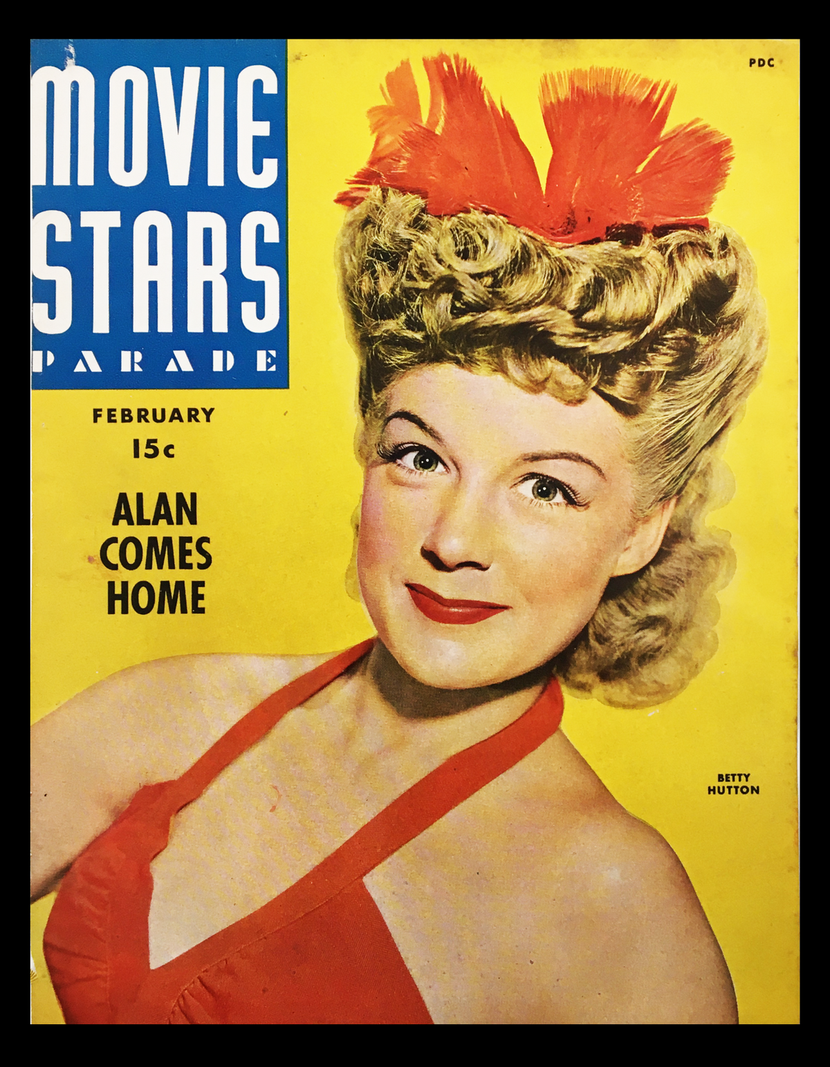 COVER ONLY Movie Stars Parade Magazine February 1944 featuring Betty Hutton in a vibrant red outfit against a bright yellow background.