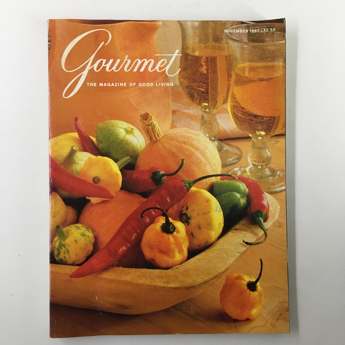 Cover of VTG Gourmet Magazine November 1987 featuring a vibrant display of fruits and vegetables, including pumpkins and chili peppers, symbolizing sweet and savory culinary themes.