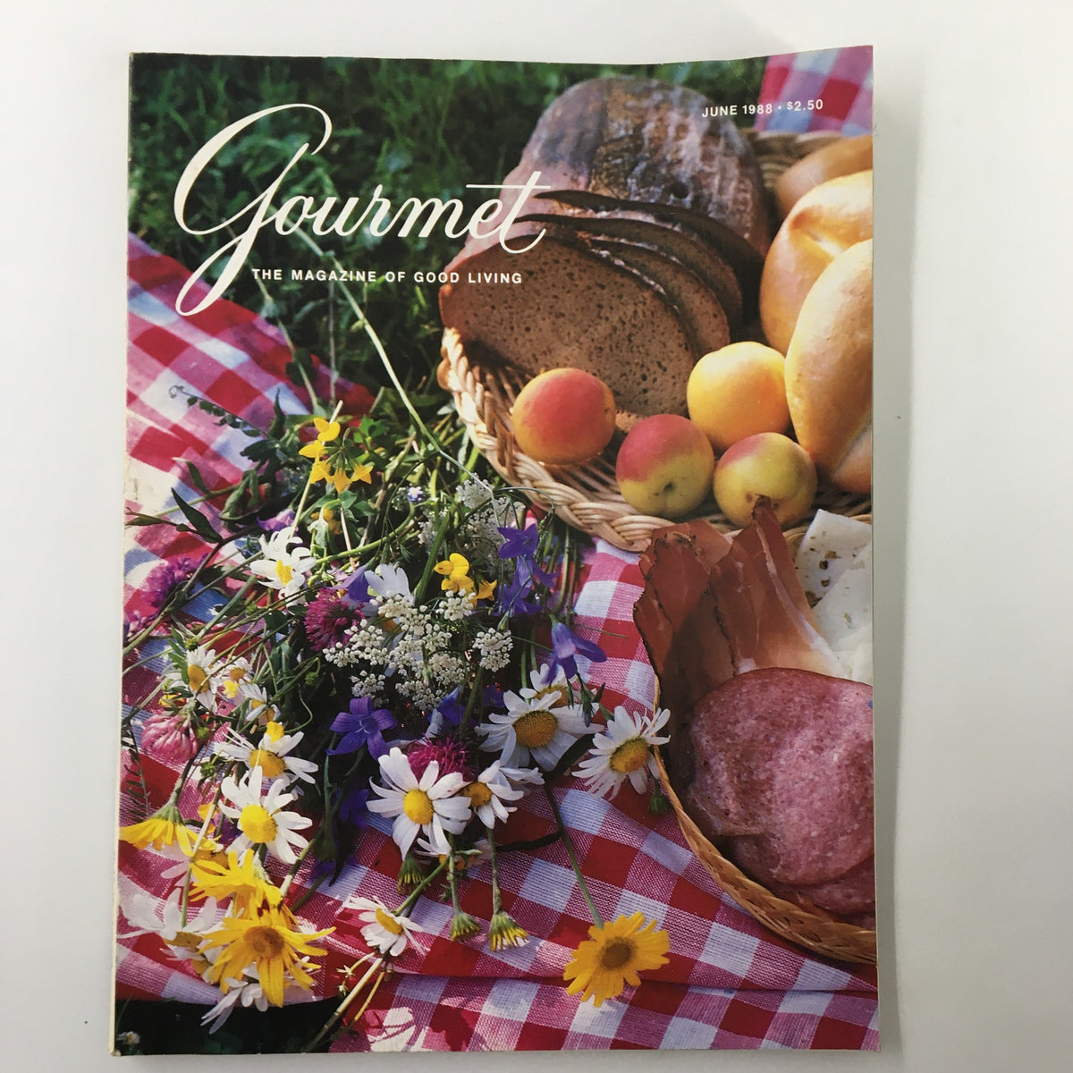 VTG Gourmet Magazine June 1988 cover featuring a picnic basket filled with bread and fruits, surrounded by colorful wildflowers, reflecting the theme A Taste of Astrology for Gemini.