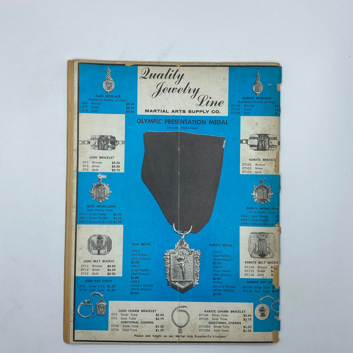 VTG Black Belt Magazine August 1966 showing an advertisement for Quality Jewelry Line with Olympic presentation medals and various judo and karate accessories.