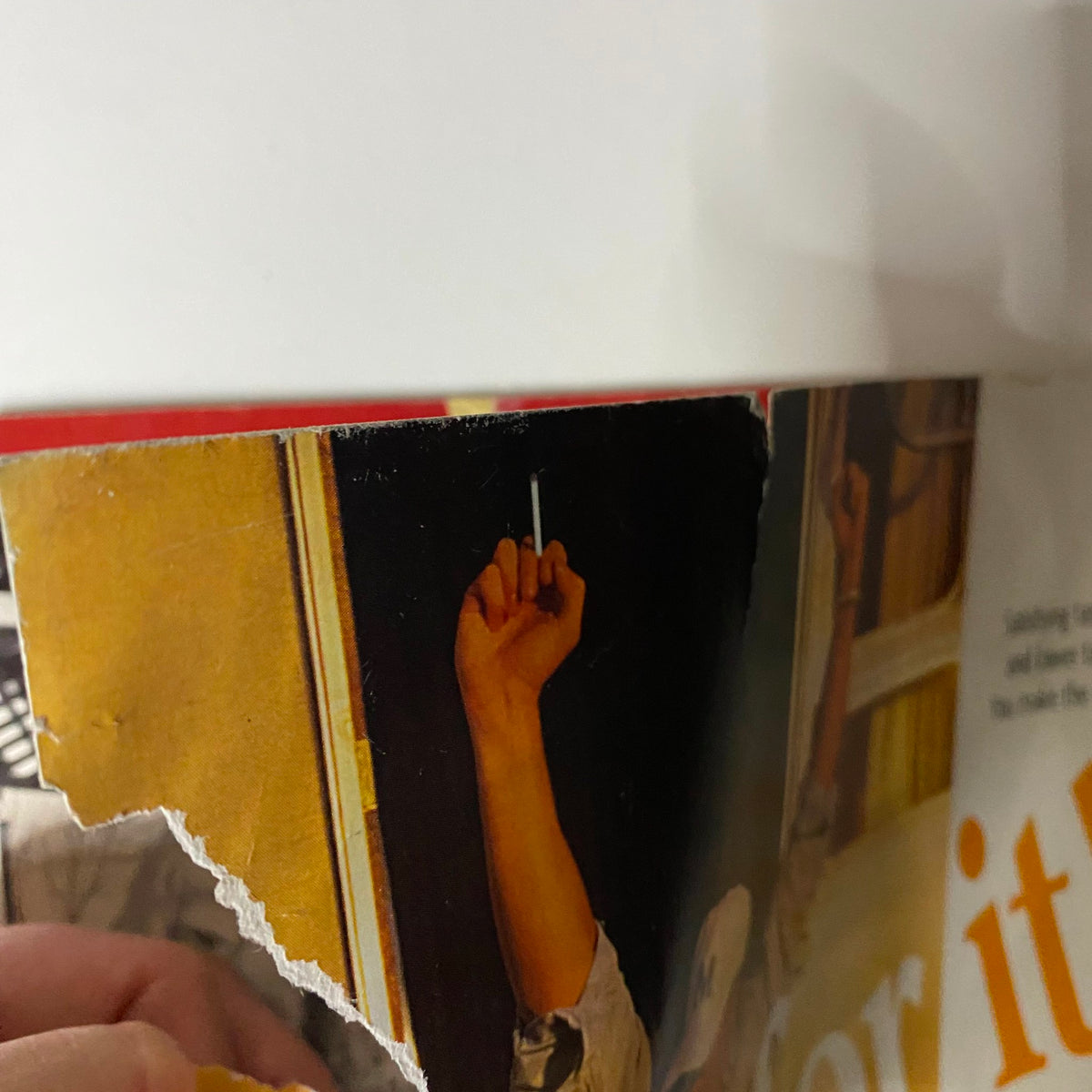 Close-up of the torn edge of the set cover of Life Magazine, June 5, 1995, showcasing a hand holding a cigarette, emphasizing the era's cigarette advertising themes.