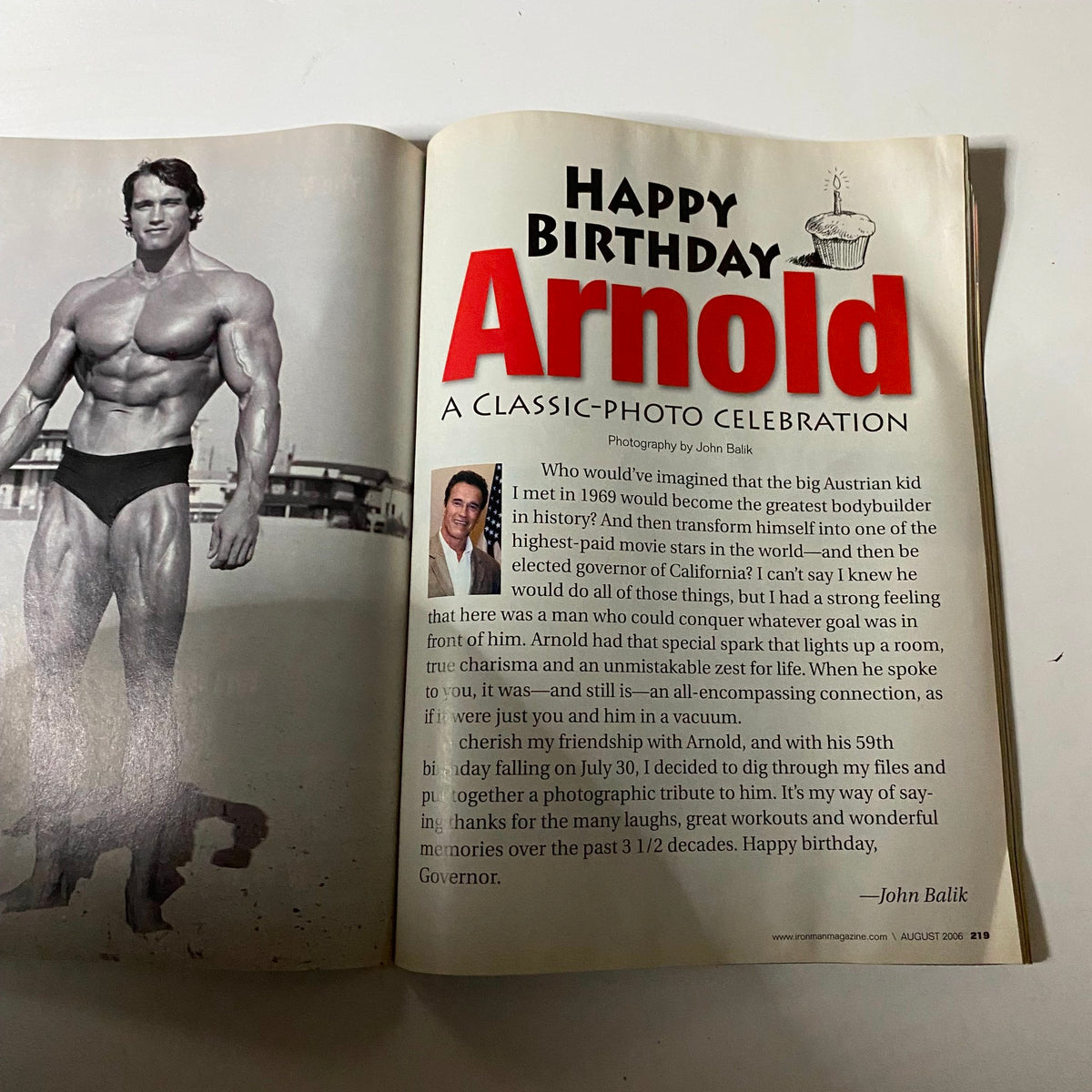 Inside page of Iron Man Magazine August 2006, celebrating Arnold Schwarzenegger's birthday with a photo and an article reflecting on his legacy in bodybuilding.