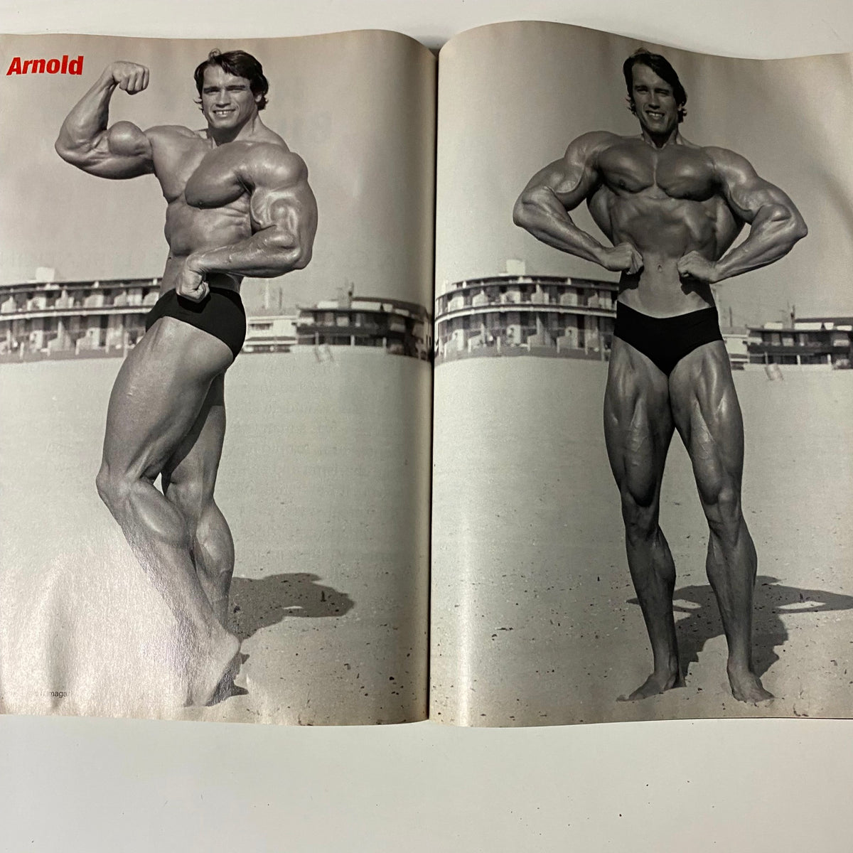 Iron Man Magazine August 2006 Arnold Schwarzenegger cover showcasing Arnold flexing his muscles on the beach, highlighting his iconic physique in a vintage bodybuilding context.