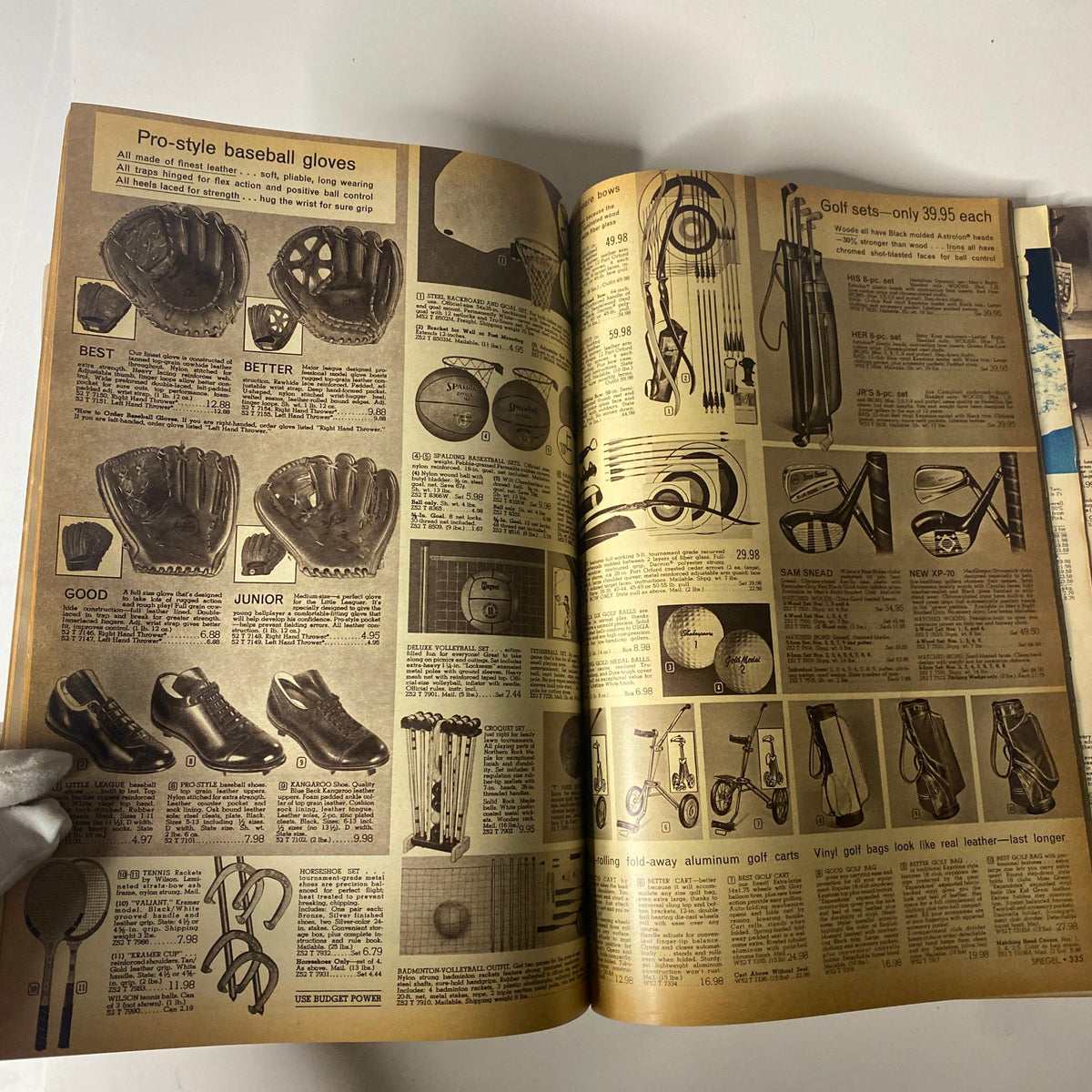 Inside spread of the 1968 Spiegel Spring and Summer Catalog featuring various sports equipment including pro-style baseball gloves, golf sets, and tennis racquets.