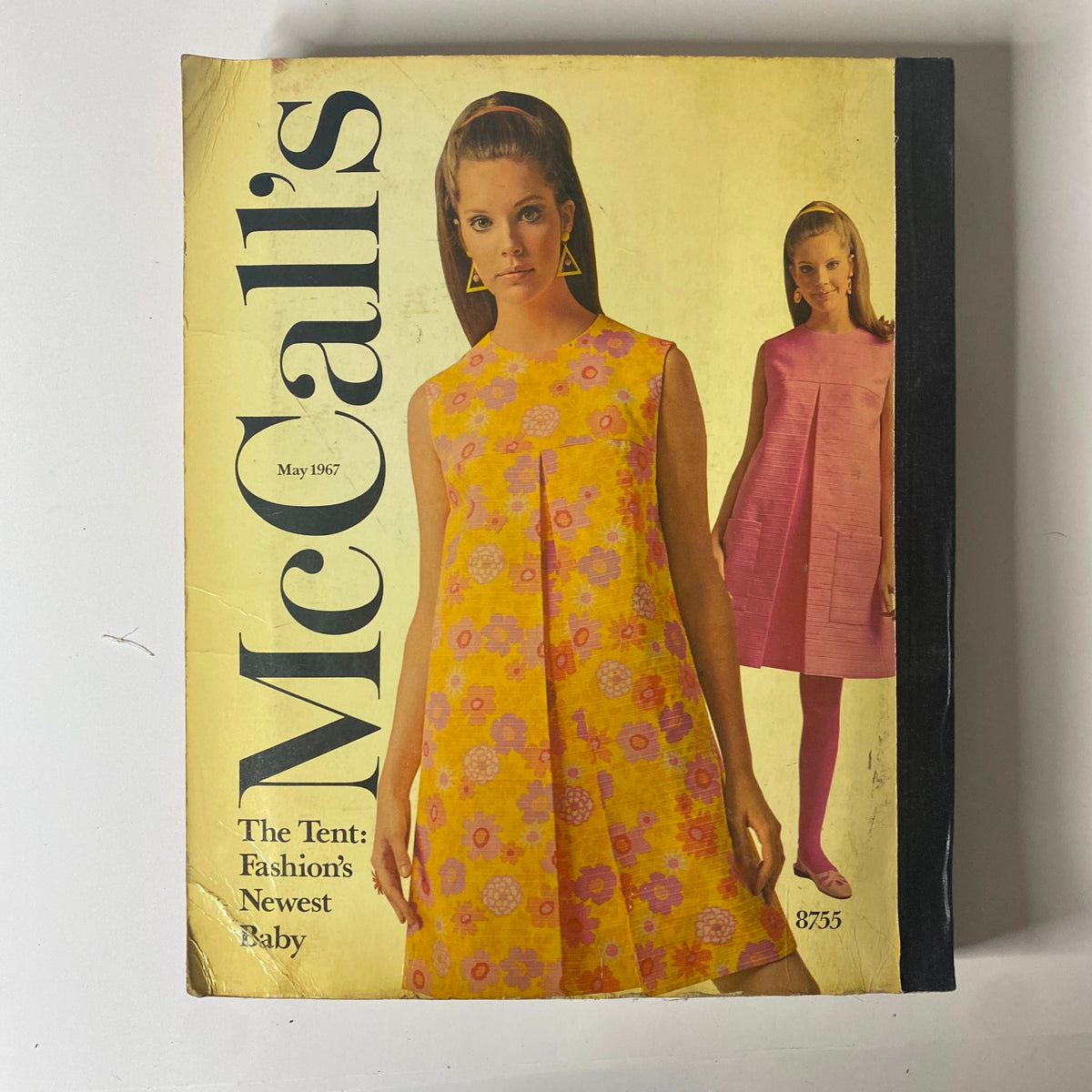1967 May McCall's New York Designers' Collection showcasing fashionable women's clothing, with a bright cover displaying 1960s floral dresses and bold styling, highlighting vintage fashion trends.