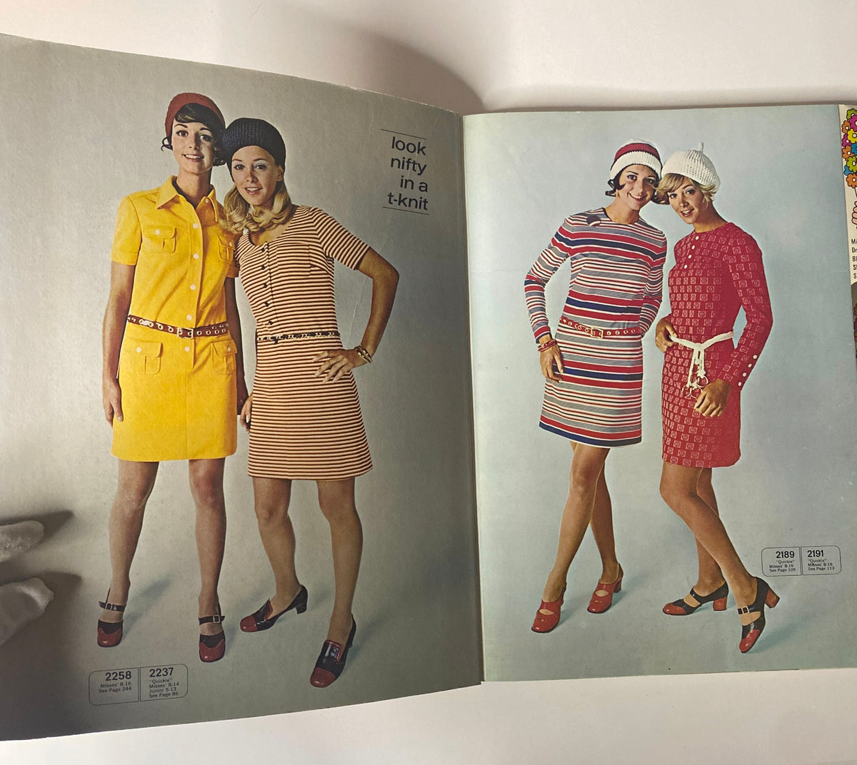 Interior of the 1970 McCall's School Spring Huge Store Retail Counter Catalog displaying two models wearing stylish knit dresses from the 1970s, highlighting school and casual fashion trends.