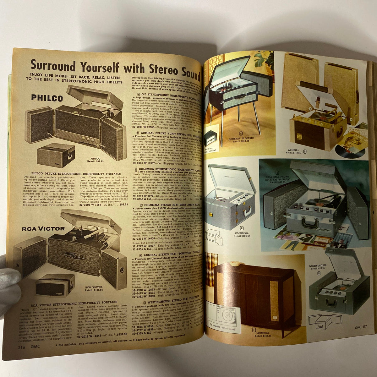 1961 General Merchandise Company Spring and Summer Catalog page illustrating vintage stereo record players, including models from Philco and Columbia, demonstrating mid-century design in audio technology.