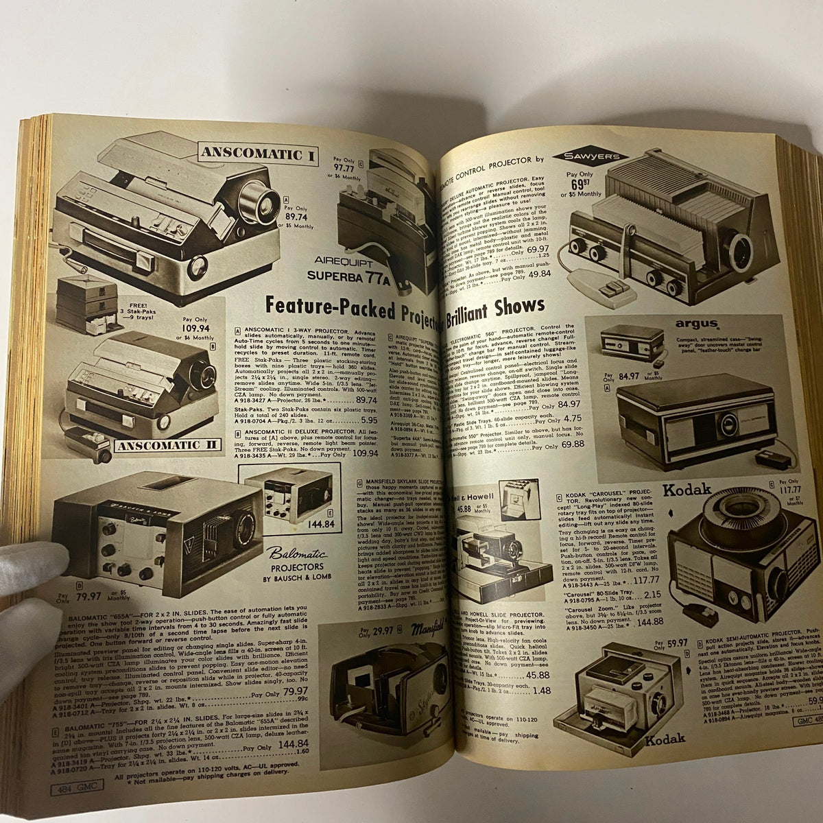 1963 General Merchandise Company Spring and Summer Catalog illustrating a variety of projectors, showcasing feature-packed models available for sale along with their specifications and pricing.