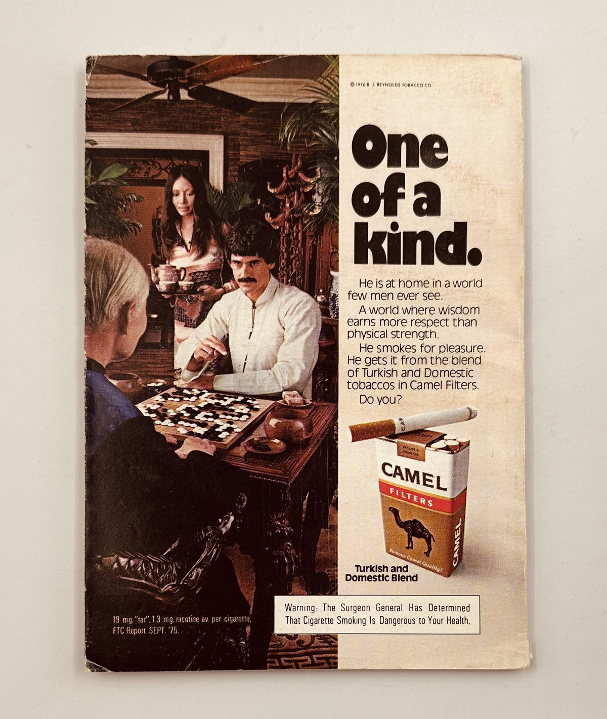 Back cover of Baseball Digest Magazine June 1976 showcasing a Camel cigarette advertisement with a character in a conversation.