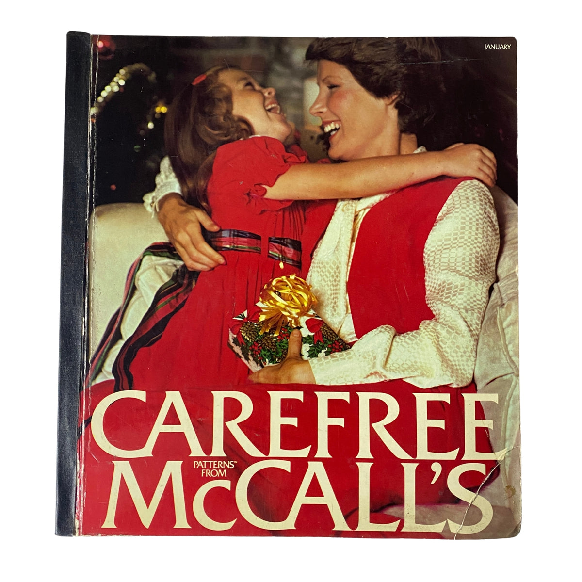 1973 January Carefree McCall's Huge Store Retail Counter Catalog cover featuring a mother and daughter smiling and celebrating, showcasing a vintage design that embodies early 1970s fashion.