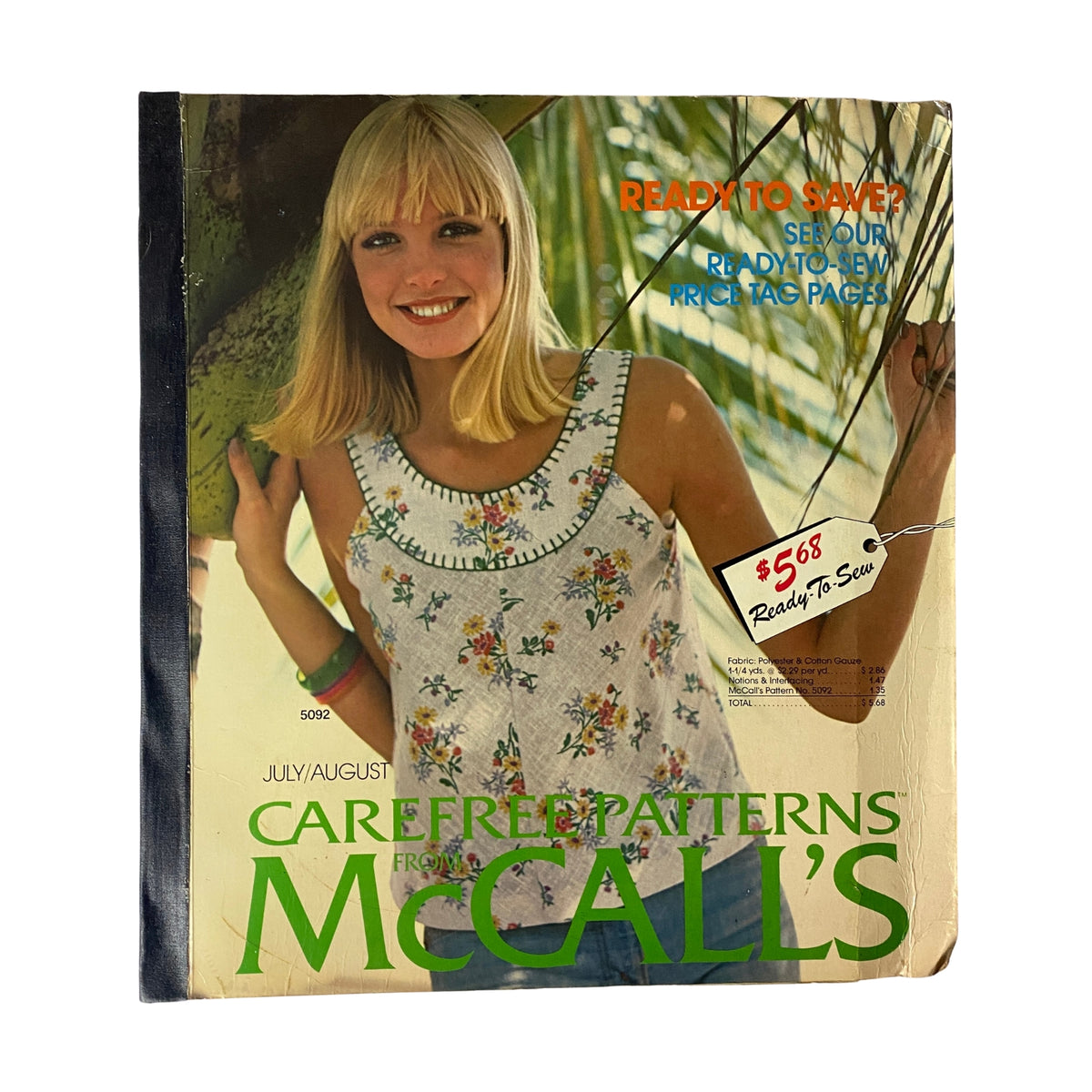 Cover of the 1975 July-August Carefree Patterns McCall's Catalog featuring a model in a floral-patterned tank top, highlighting summer fashion trends and sewing patterns.